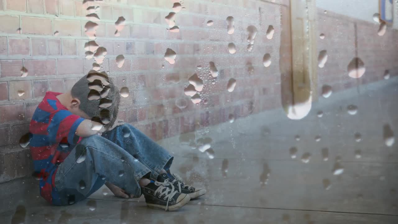 머리를 숙여 벽에 앉아 있는 화가 난 소년의 디지털 애니메이션 4k