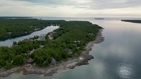 Aerial-view-of-Lake-Huron-Coastline-of-Big-Tub-Harbor-and-Lighthouse