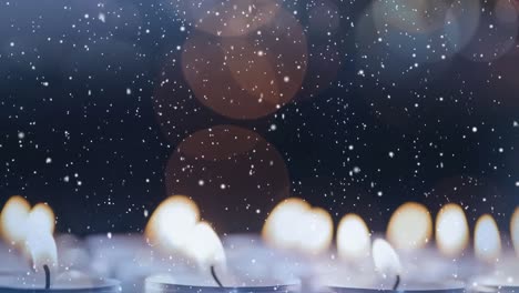 velas combinadas con la nieve que cae