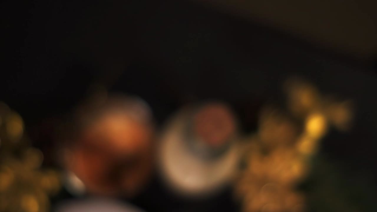 Top angle fly in slow motion of a glass of traditional holiday drink Christmas eggnog