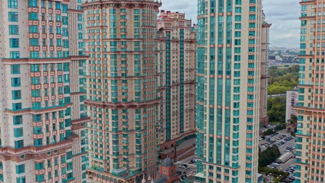 AERIAL-aerial-photography-next-to-a-group-of-modern-stylized-skyscrapers-in-the-urban-area,-Moscow,-Russia