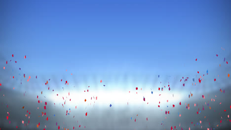 animation of multi coloured confetti falling over empty sports stadium