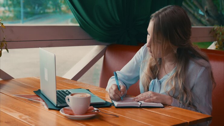 Woman Working in a Cafe