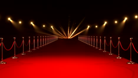 alfombra roja larga con reflectores contra un fondo rojo