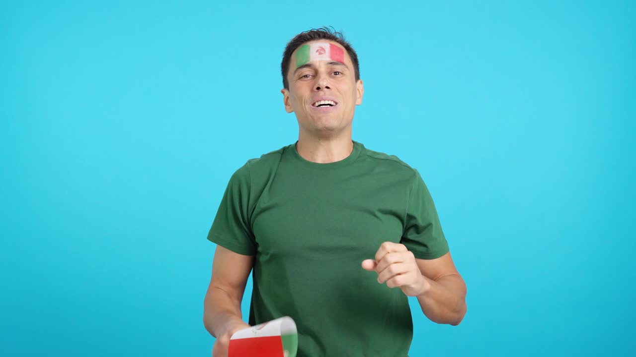 Man cheering for Mexico during a match that is lost
