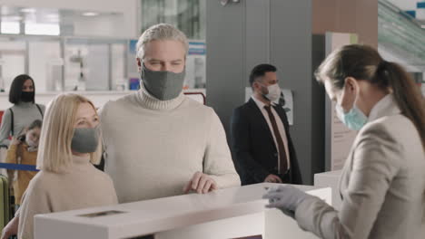 couple passing passport control in airport
