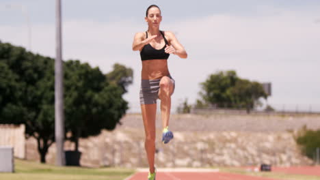 sportswoman doing long jump