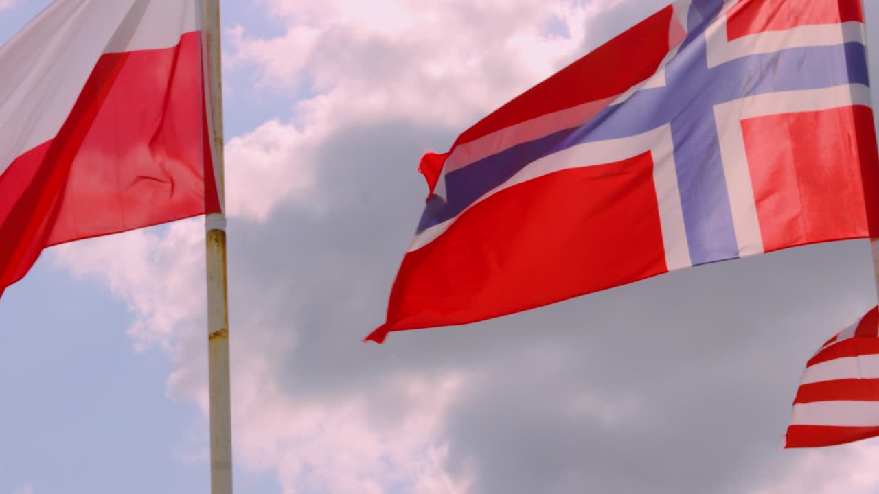 Britain, Poland, Norway, USA, Canada, France Flags Waving in Wind in Slow Motion with Bright Sky Clouds Background. United, Patriotic, Nationalistic Concept Footage 4K