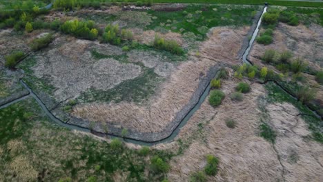 Uitbergen-and-Bergenmeersen-Overflowed-Land-and-River-Scheldt,-Aerial-Reveal