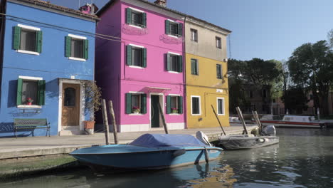 colorful facades of small houses of italian burano on a sunny day