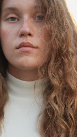 close-up portrait of a woman with curly hair