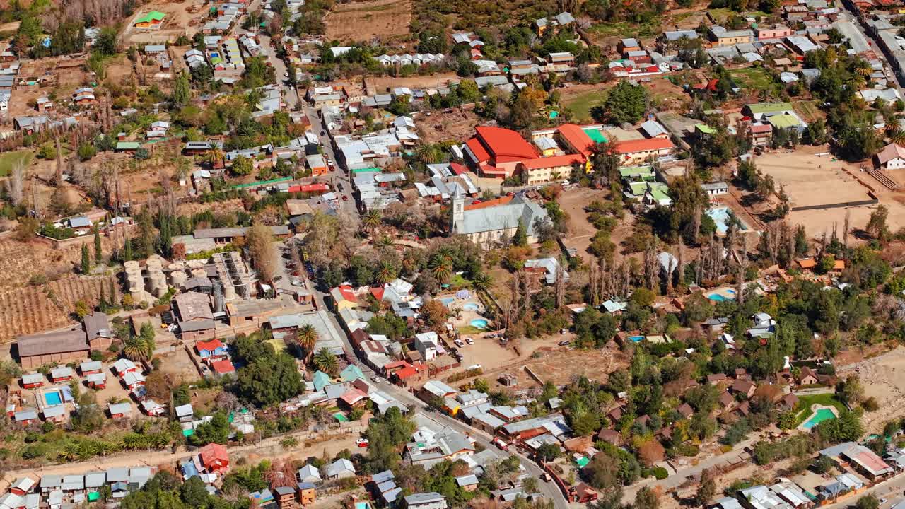 Bird's eye view of the village of Pisco Elqui with the warm colors of northern Chile, arid surroundings on a sunny day. Northern village of Pisco