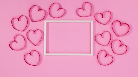 los corazones del día de san valentín se mueven alrededor del marco para el texto. detenga el movimiento