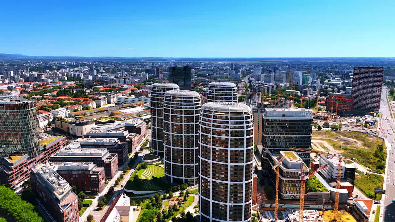 New similar buildings of unusual shape in the scenery of Bratislava, Slovakia. Constructions sites can be seen in the cityscape. Aerial view