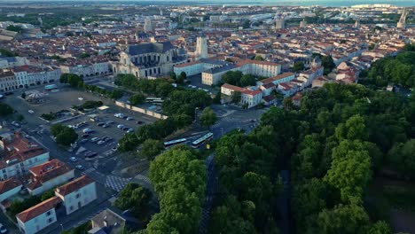 aerial view of a french city with a cathedral and river