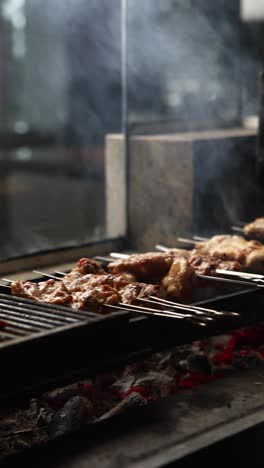 grilled meat skewers on a charcoal grill
