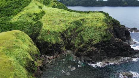 cliffs and headlands jutting into the sea in baras, catanduanes, philippines - aerial shot