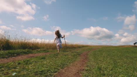 a girl running through a field