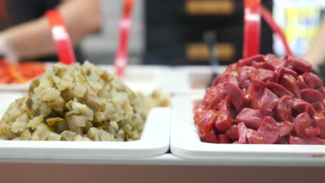 assorted prepared meats and pickles at a food market
