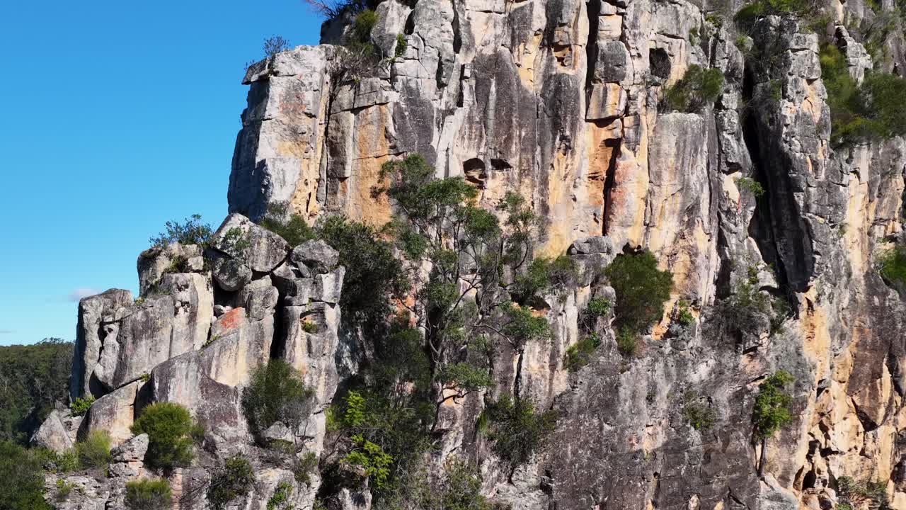 Stunning rock formations under clear blue skies in Nimbin, NSW, captured with smooth camera movement