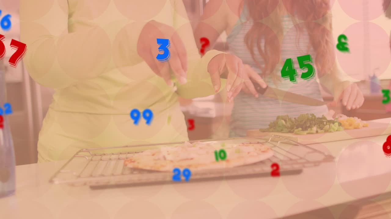 Mid adult woman slicing greens at island starting group pizza making with animated ingredient icons