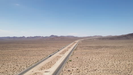 aerial panoramic view of freeway in desert