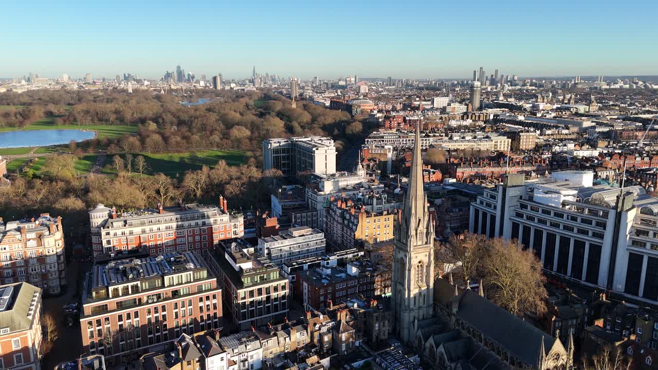 Kensington High street London UK pull back drone aerial reverse reveal