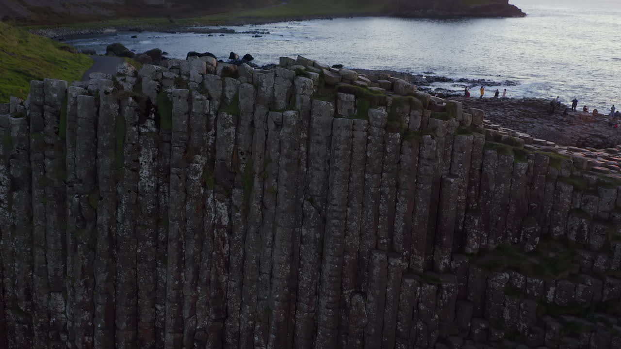Aerial Top-Down View of Basalt Columns at Giant's Causeway with Sunset Reveal