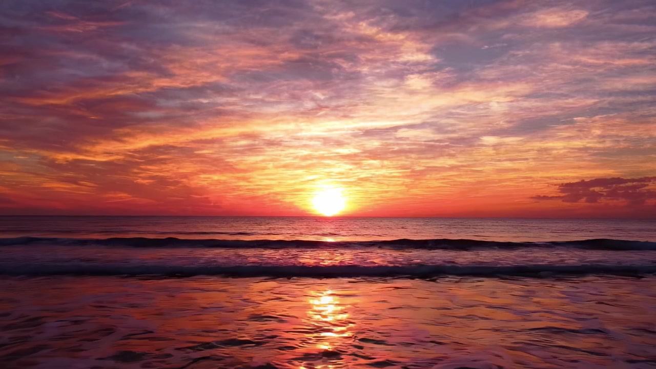 A Captivating Sunset Over Tranquil Waters, Illuminating the Sky with Vibrant Hues of Orange, Pink, and Purple as the Day Transitions into Night