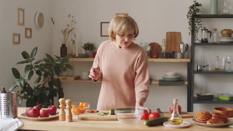 elderly woman giving online culinary class