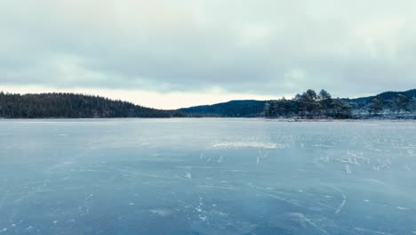 indre fosen, trondelag county, norway - the ice-covered omundvatnet - aerial pan left