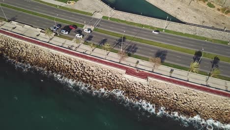 aerial view of coastal city road and promenade