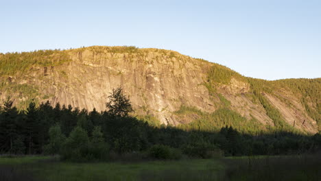 sunlight moves down mountain peak time lapse, hillestad, norway