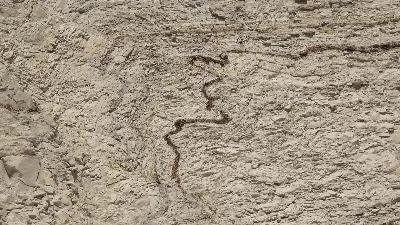 Geological Rock Formation Showing Sedimentary Layers and Fault Line