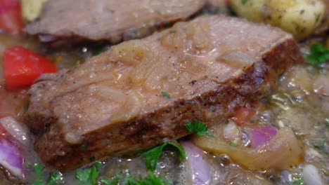 cooking meat with onions close up