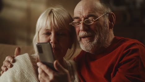 older couple looking at a smartphone