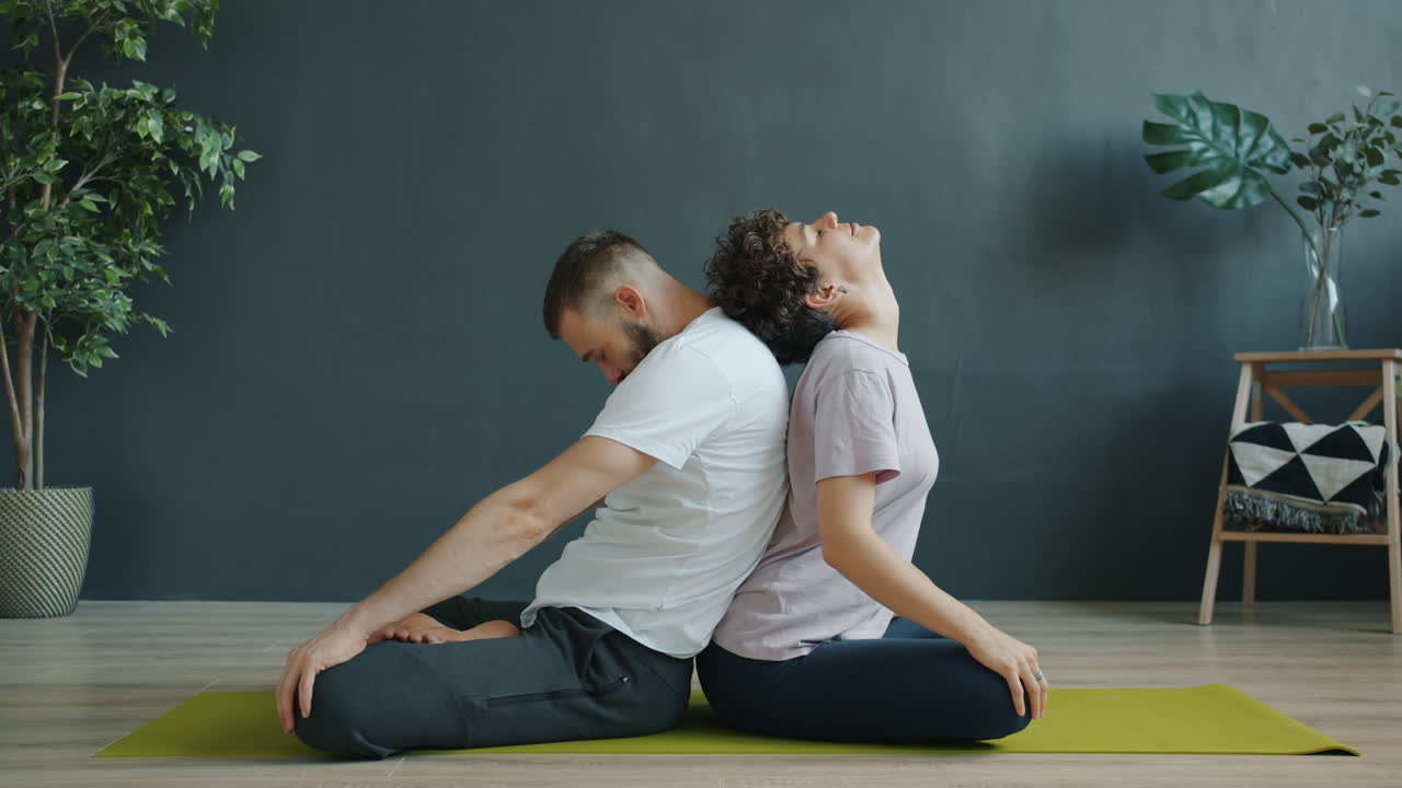 Couple Practicing Backbend Yoga Pose