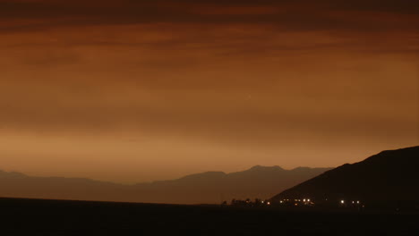 Time-lapse-of-sunset-in-hazy-skies-over-a-coastal-city