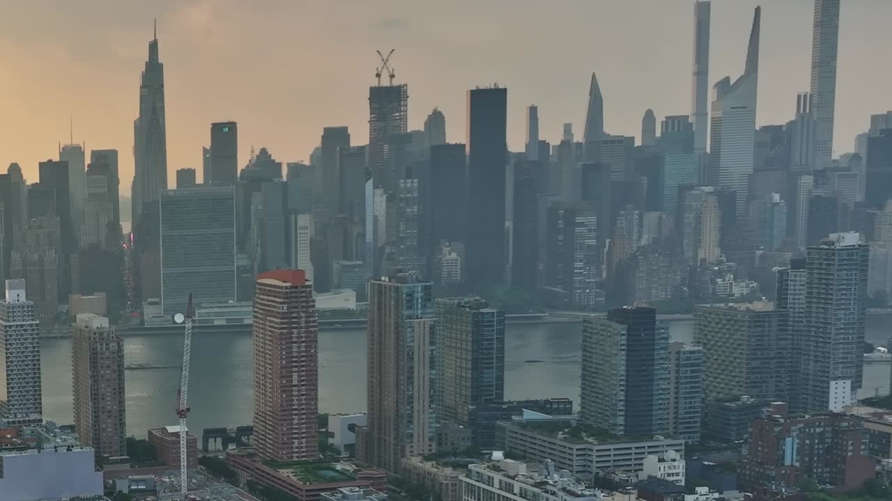 Stunning drone view of New York City skyline at sunset