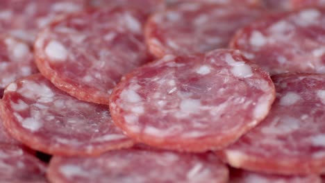 cut into pieces salami slowly rotates.