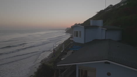 Drone-shot-of-house-beside-beach