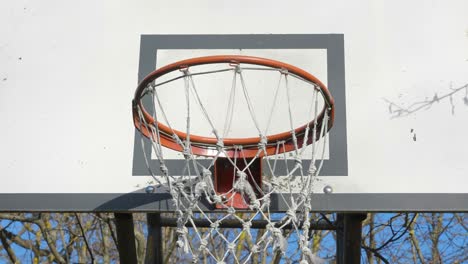 closer look of the basketball ring and the net