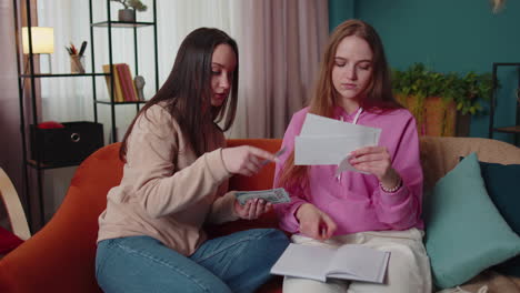 girls siblings checking household payments, calculating bills, feels panic about bankruptcy problem