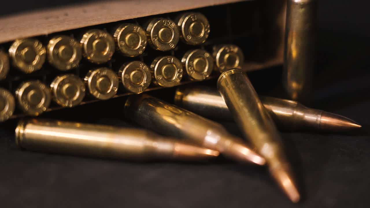 Left pan across dark look at ammo.