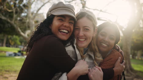 friends hugging in the park