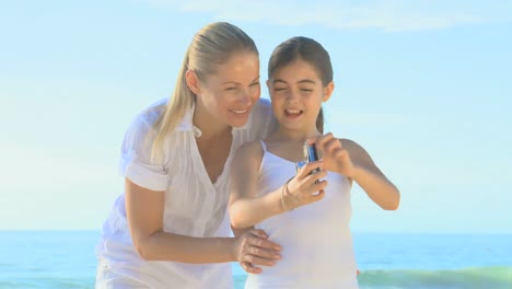 mother and daughter taking a photo of themselves