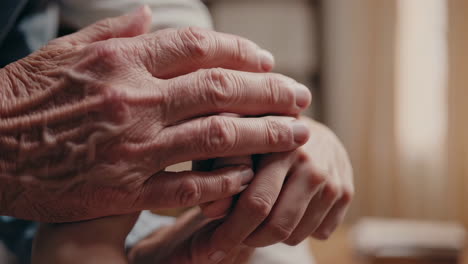 intergenerational connection: elderly and young hands holding