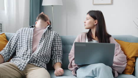 couple discussing on couch