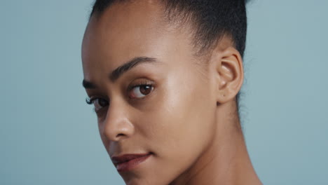 close up portrait beautiful young african american woman smooth healthy skin care looking confident gorgeous sensual beauty on blue background