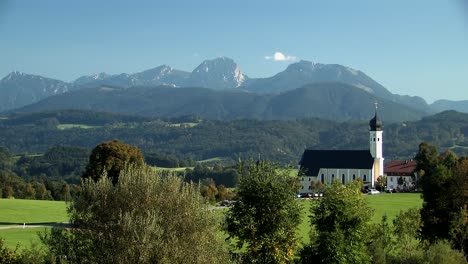 bavarian alps and church of pilgrimage wilparting in summertime, germany